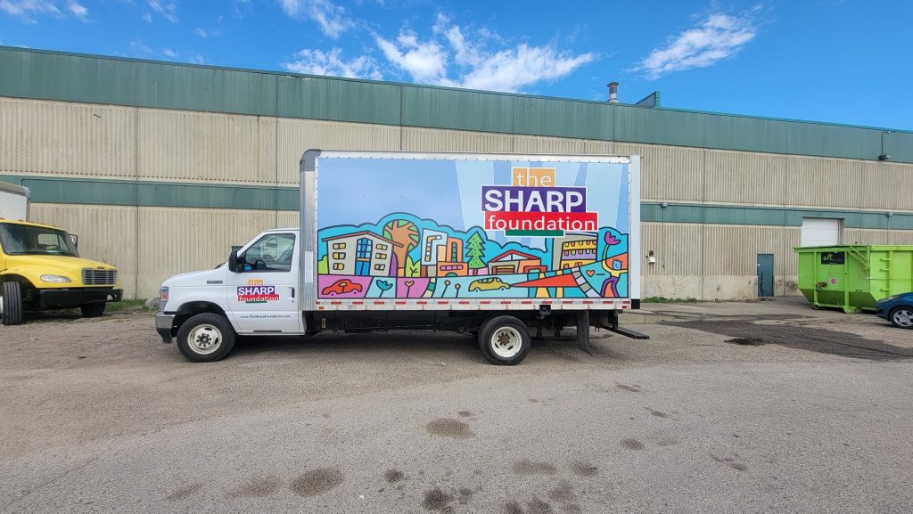 Full vehicle wrap for The SHARP Foundation, made by Summit Signs & Design