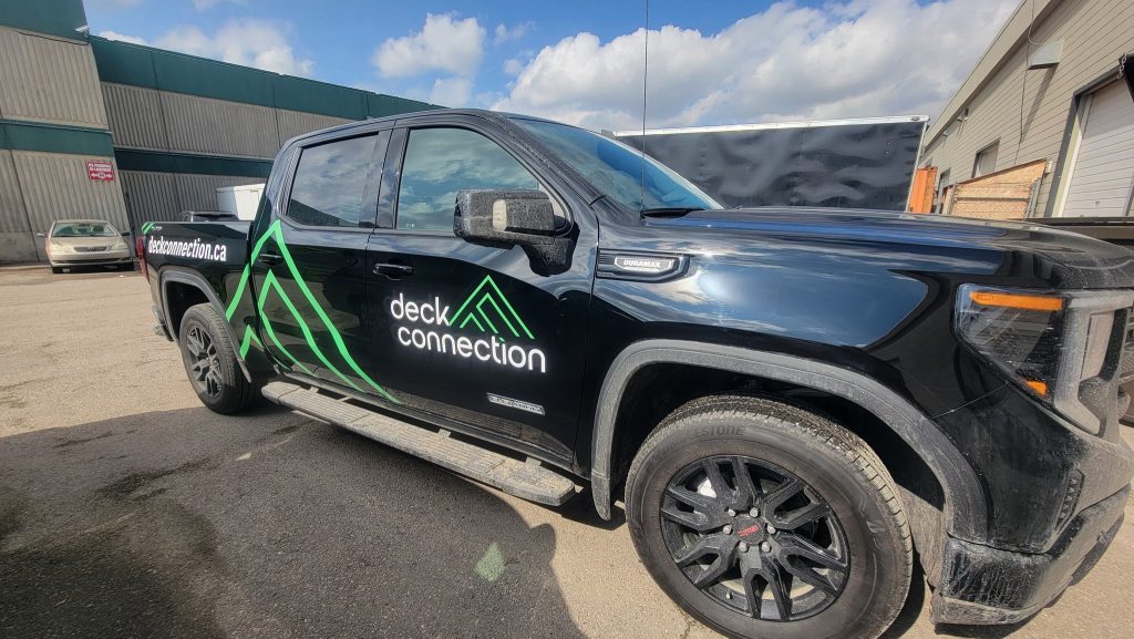 Vehicle wrap on a black pickup truck