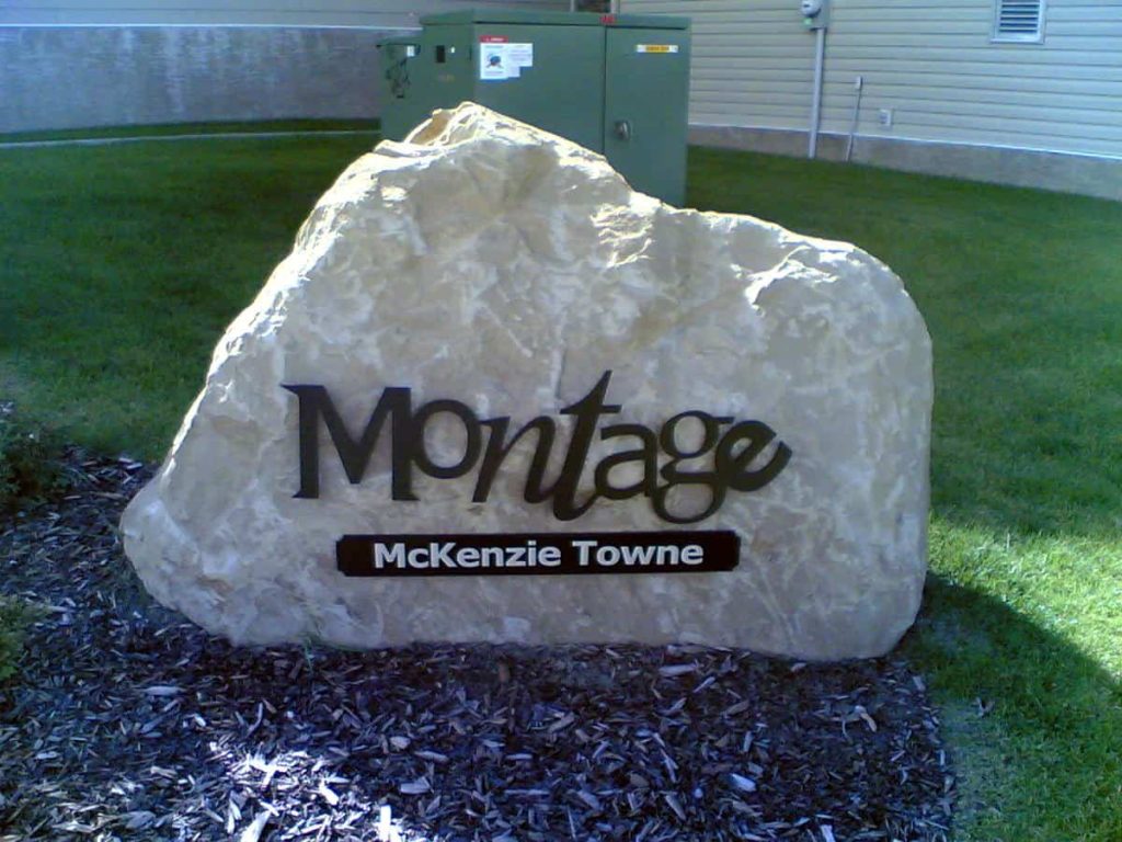 Dimensional metal letters on a stone boulder for Montage, McKenzie Towne, Calgary