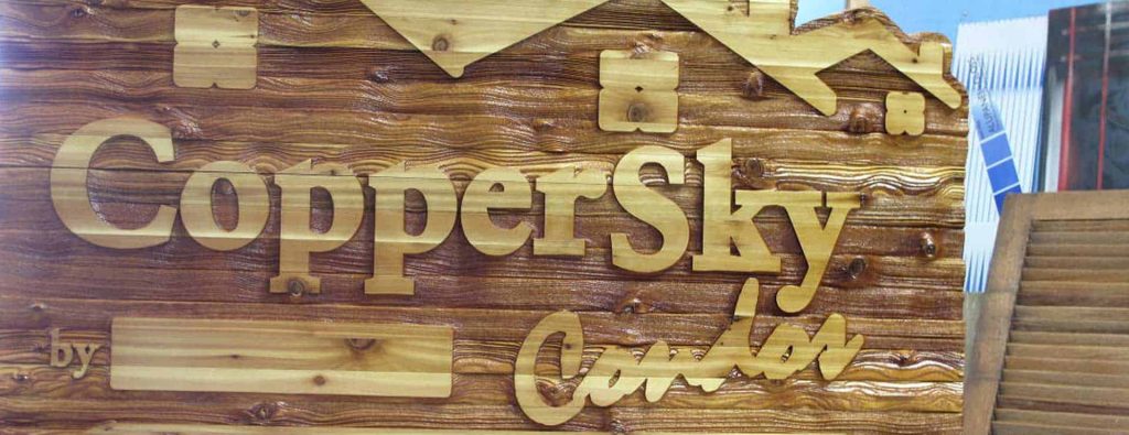 Close-up of the sandblasted wood sign for Copper Sky Villas